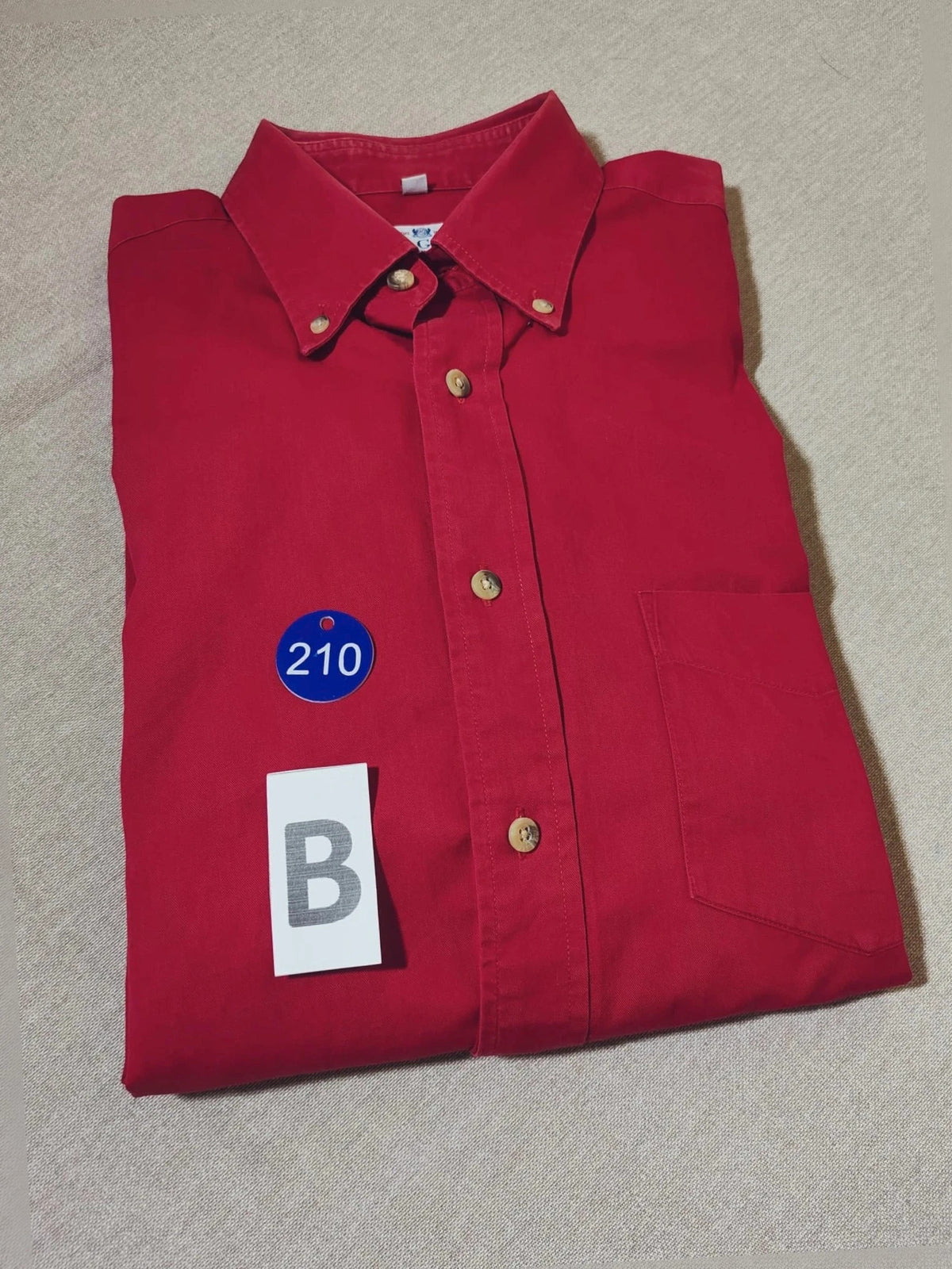 Boggi men's shirt burgundy button-down collar with textured buttons and chest pocket.