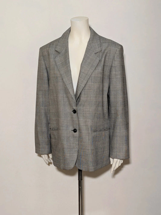 Pura Lana Vergine black and grey blazer, Prince of Wales pattern, structured shoulders, two-button closure.