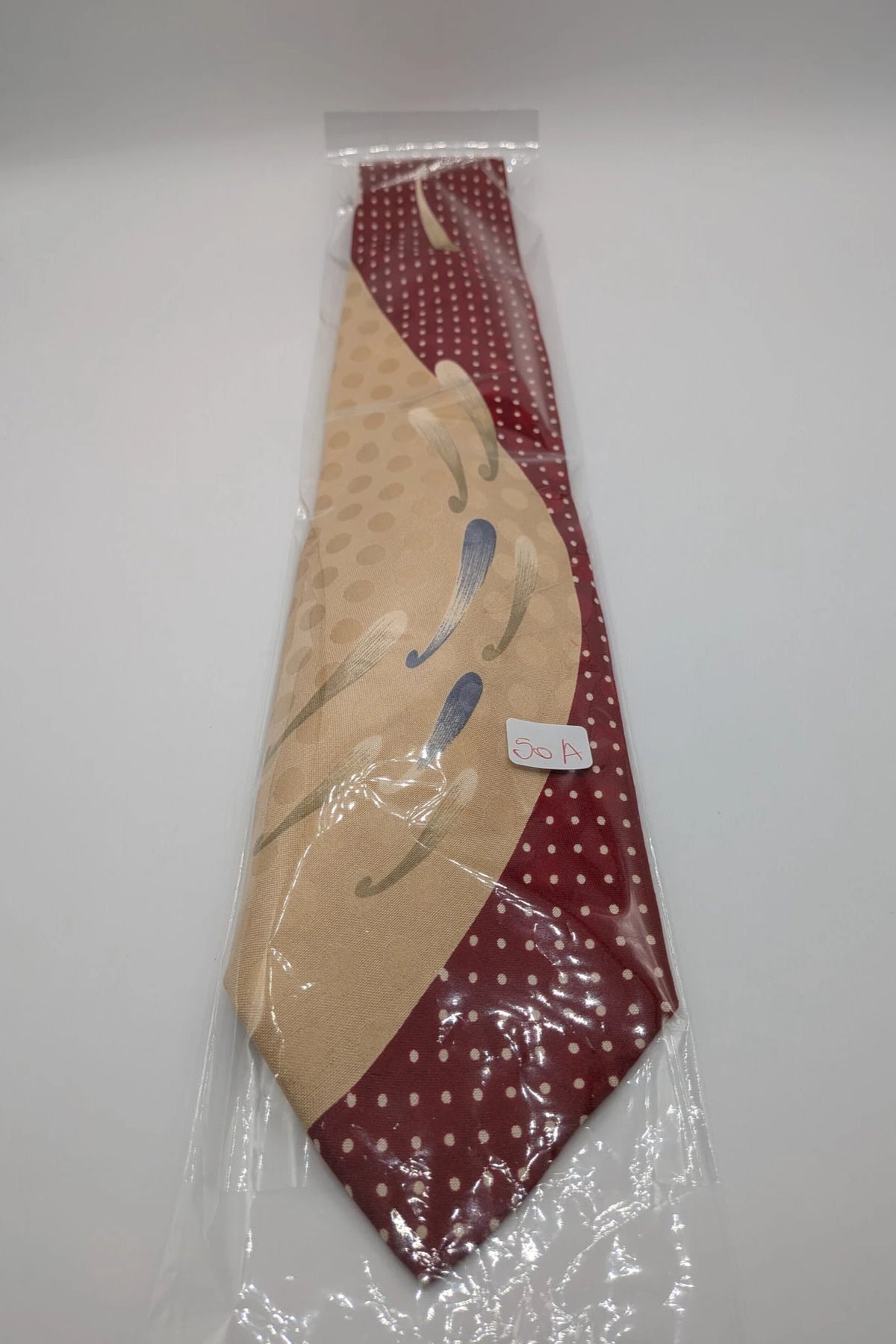 Renoma beige and burgundy tie with ivory polka dots and abstract blue-green designs.