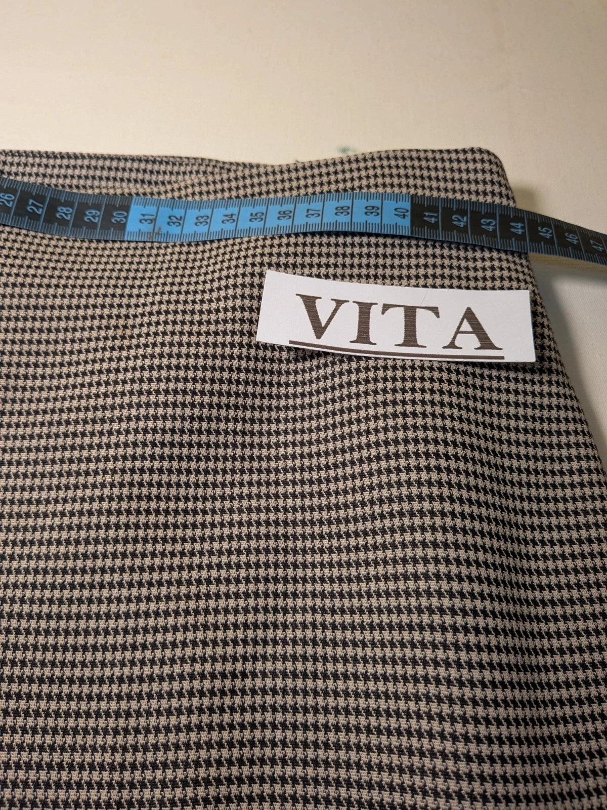 Luca D'Altieri beige and black skirt suit, micro pied de poule pattern, elegant design.