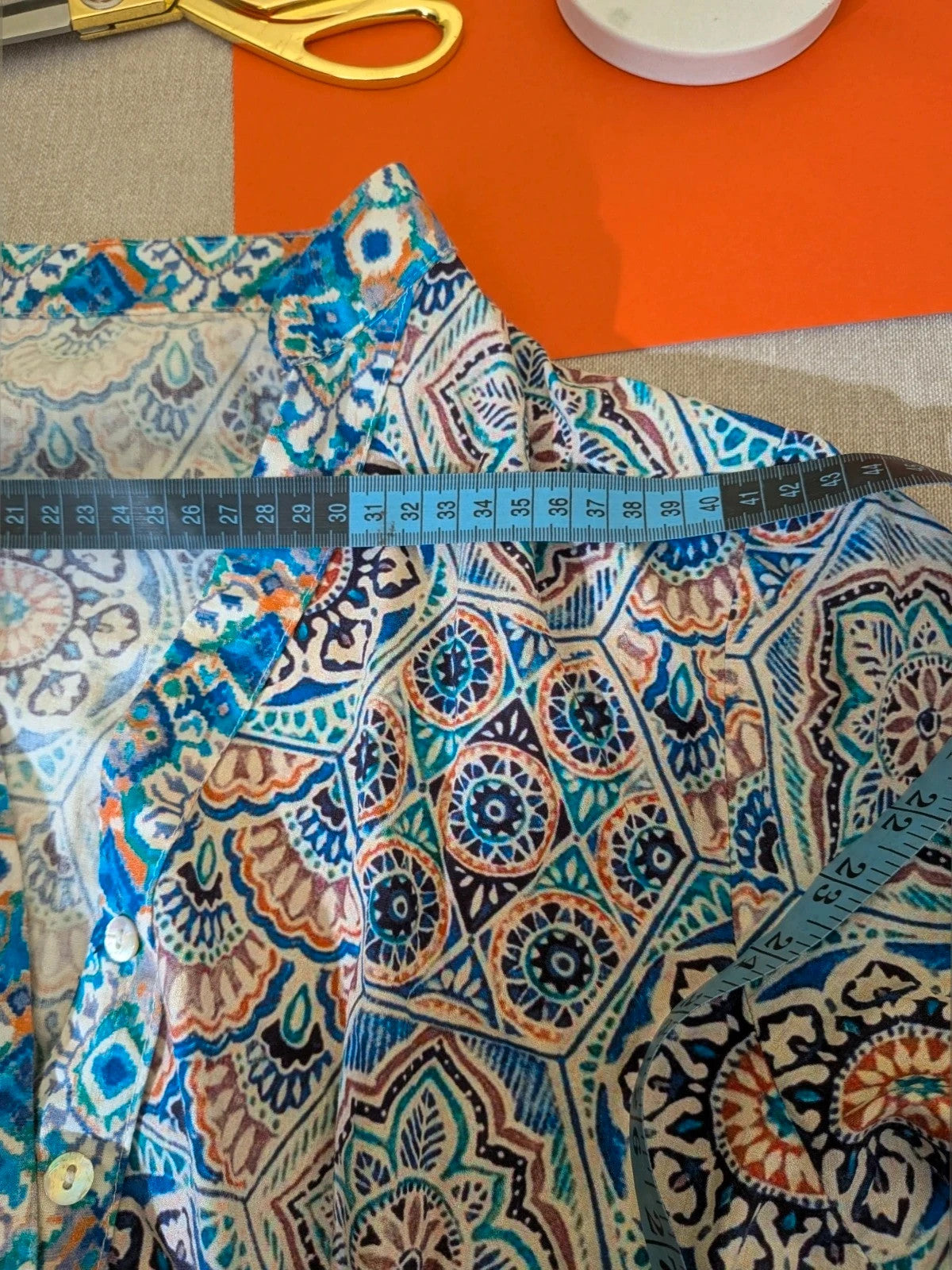 Per Una blue linen maxi dress with geometric mandala pattern and royal blue pompom details.