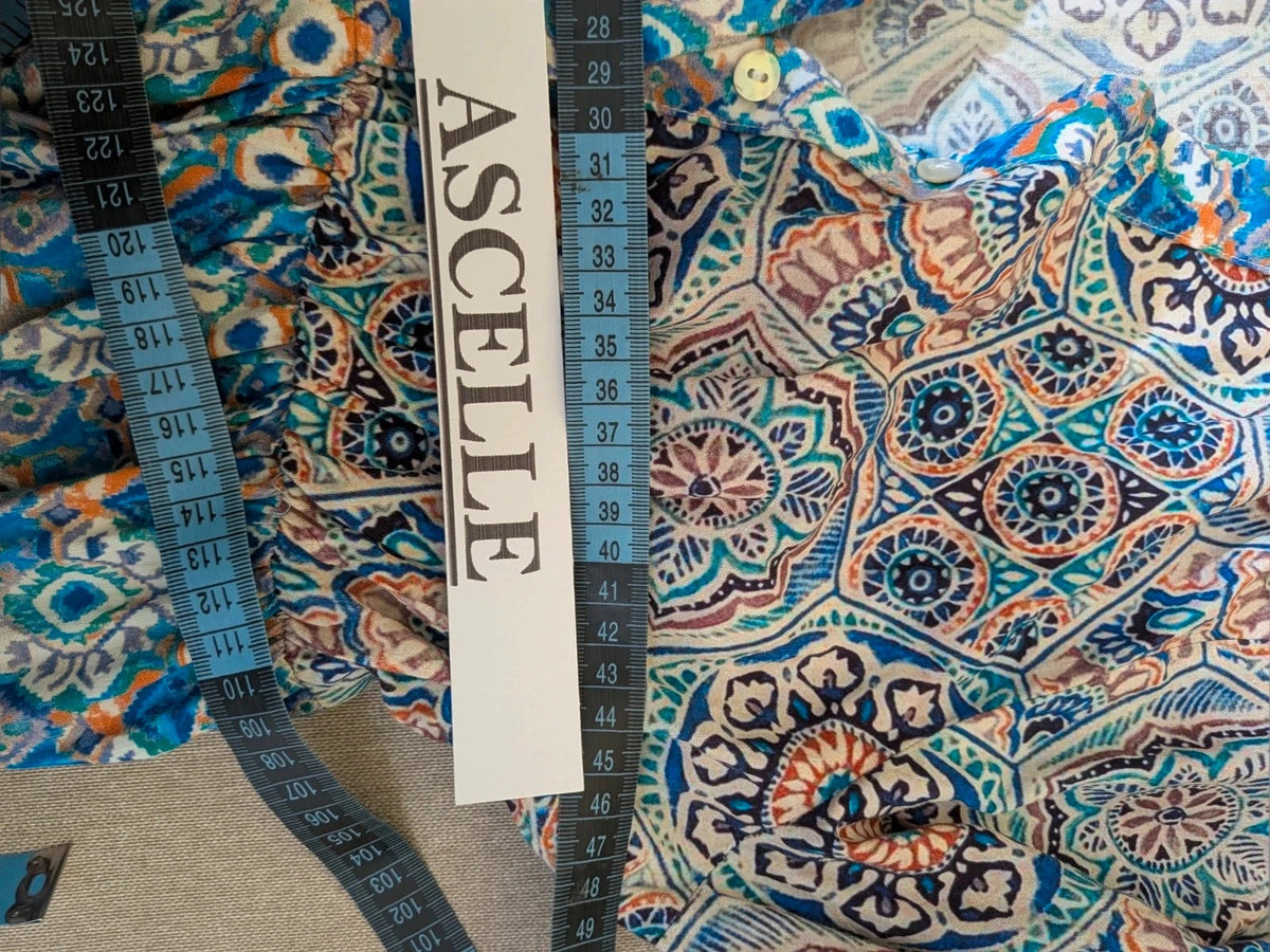 Per Una blue linen maxi dress with geometric mandala pattern and royal blue pompom details.