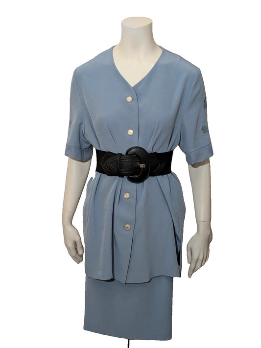 Giorgio Geraldo blue skirt suit with pearl buttons and floral lace details.