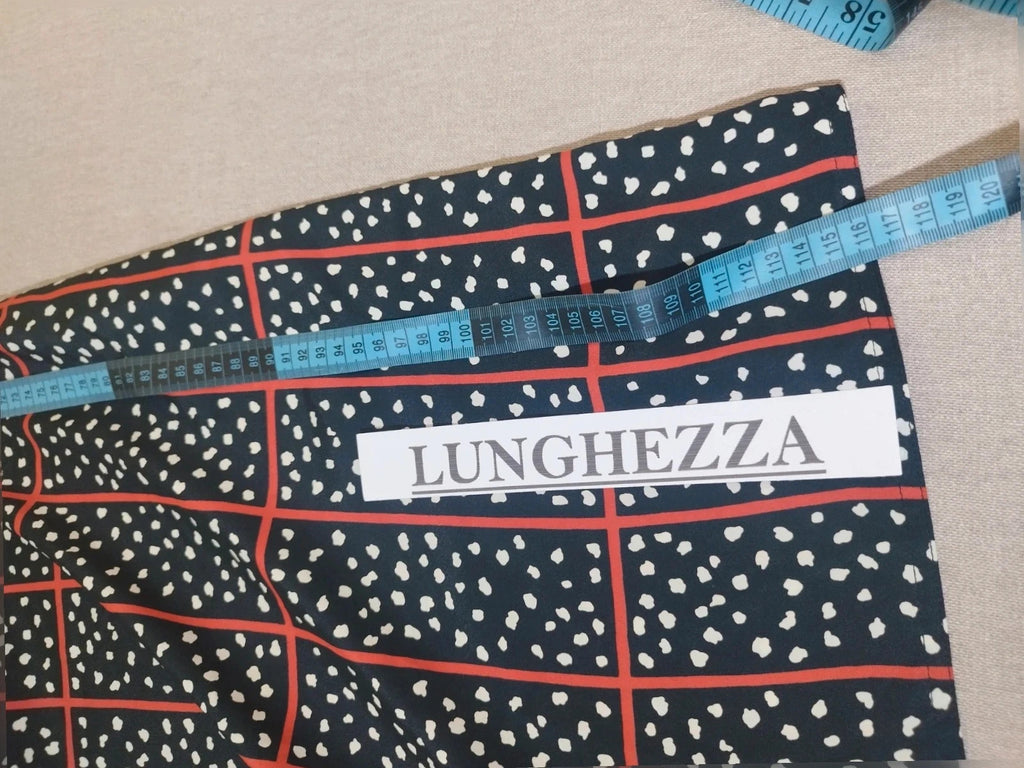 Lady Ibis black and red skirt suit with geometric pattern and polka dots, sleeveless dress.