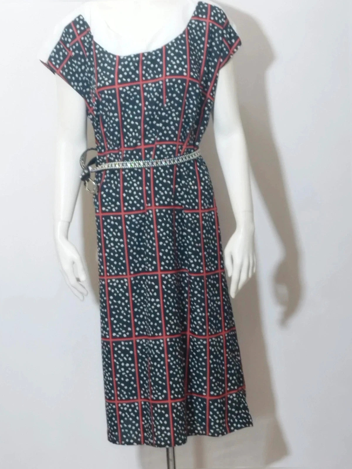 Lady Ibis black and red skirt suit with geometric pattern and polka dots, sleeveless dress.