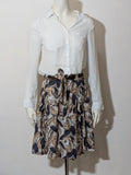 Jennifer beige skirt suit with floral pattern, white button-up shirt, lightweight polyester fabric.