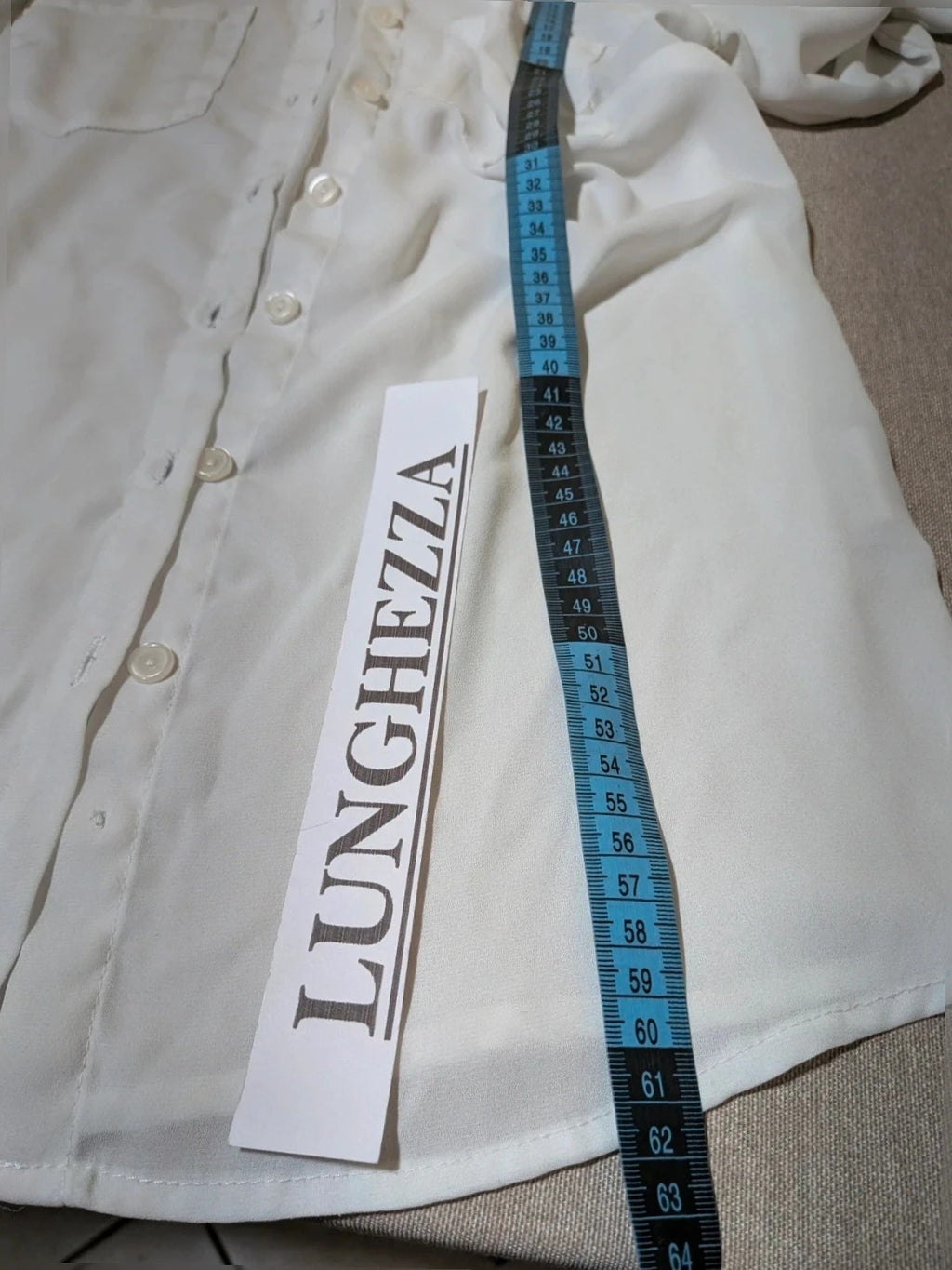 Jennifer beige skirt suit with floral pattern, white button-up shirt, lightweight polyester fabric.