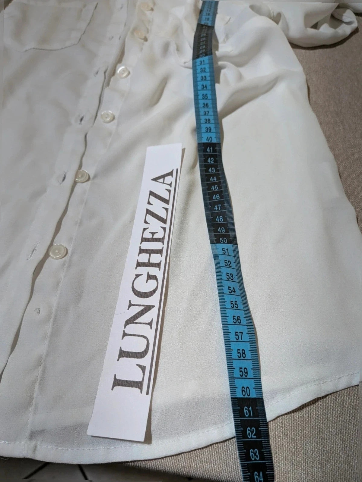 Jennifer beige skirt suit with floral pattern, white button-up shirt, lightweight polyester fabric.