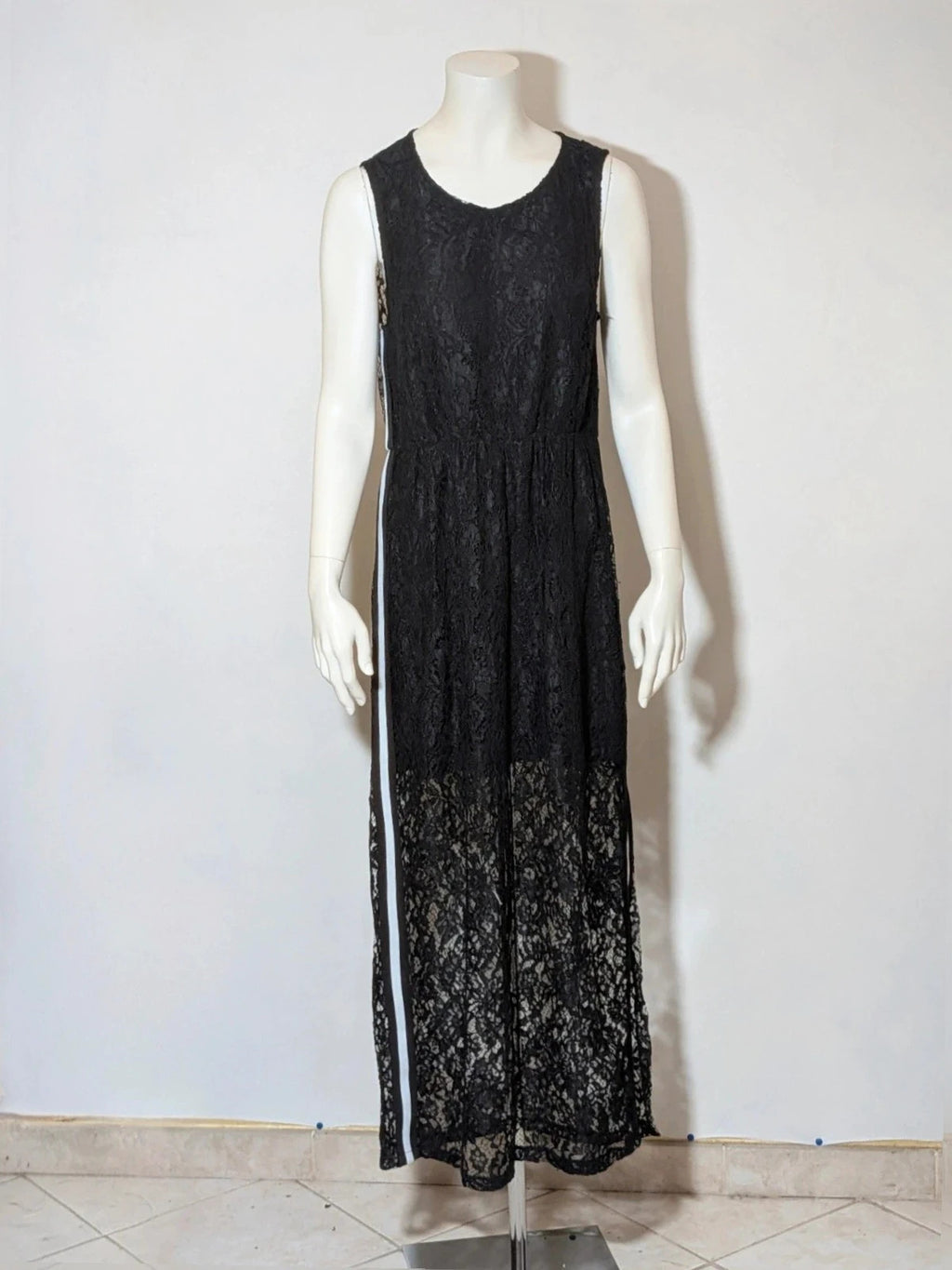Chic black linen maxi dress with floral lace, white side stripe, and sleeveless design.