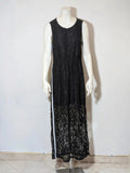 Chic black linen maxi dress with floral lace, white side stripe, and sleeveless design.