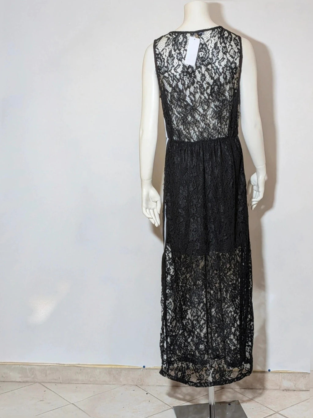 Chic black linen maxi dress with floral lace, white side stripe, and sleeveless design.