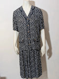 Completo Vintage black and white skirt suit with clover print, V-neck blouse, gold buttons.