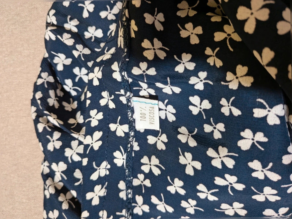 Completo Vintage black and white skirt suit with clover print, V-neck blouse, gold buttons.