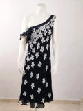 Cannella black and white floral linen maxi dress, one-shoulder design with ruffle detail.