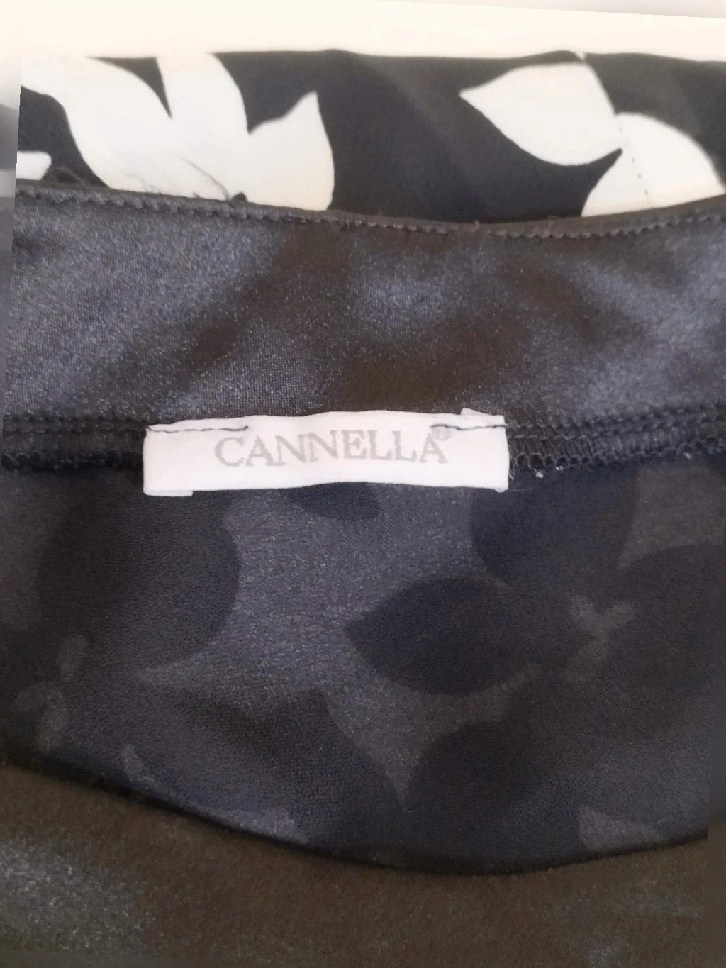 Cannella black and white floral linen maxi dress, one-shoulder design with ruffle detail.