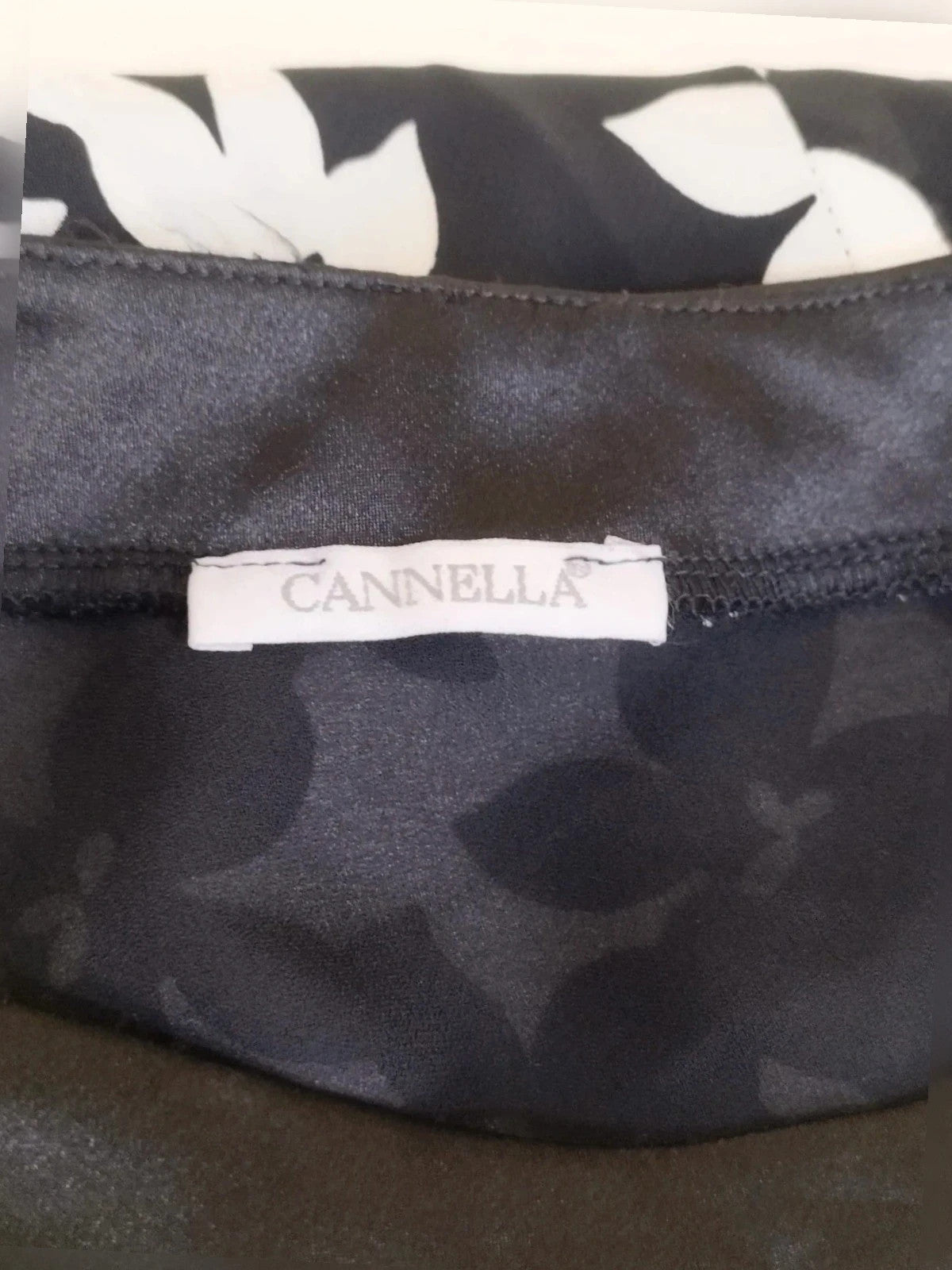 Cannella black and white floral linen maxi dress, one-shoulder design with ruffle detail.