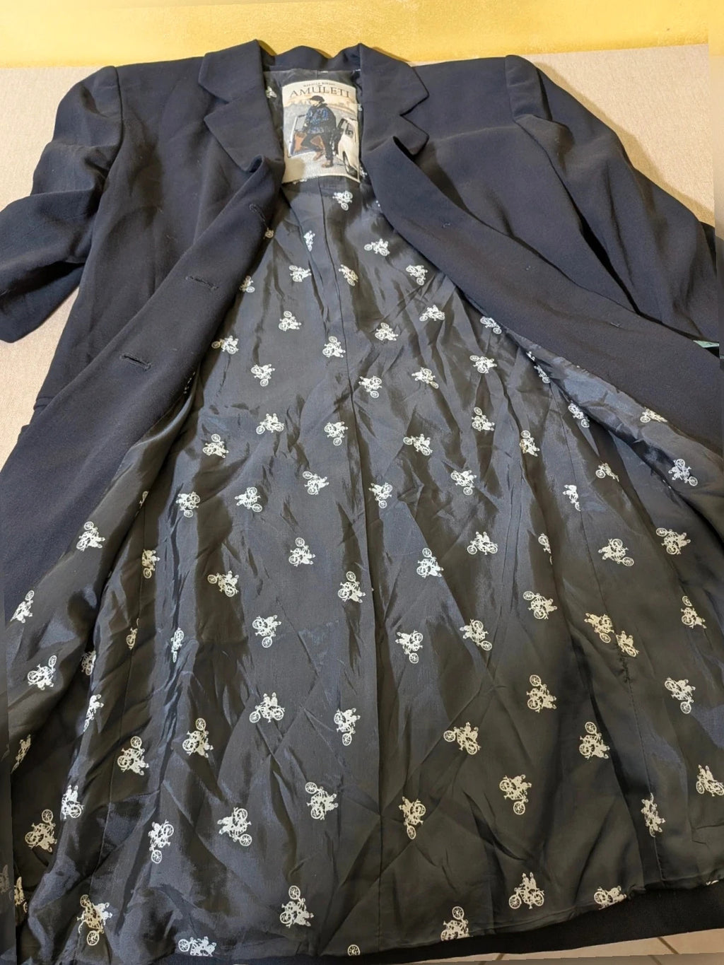 Mariella Burani navy skirt suit with elegant blazer and vintage bicycle print lining.