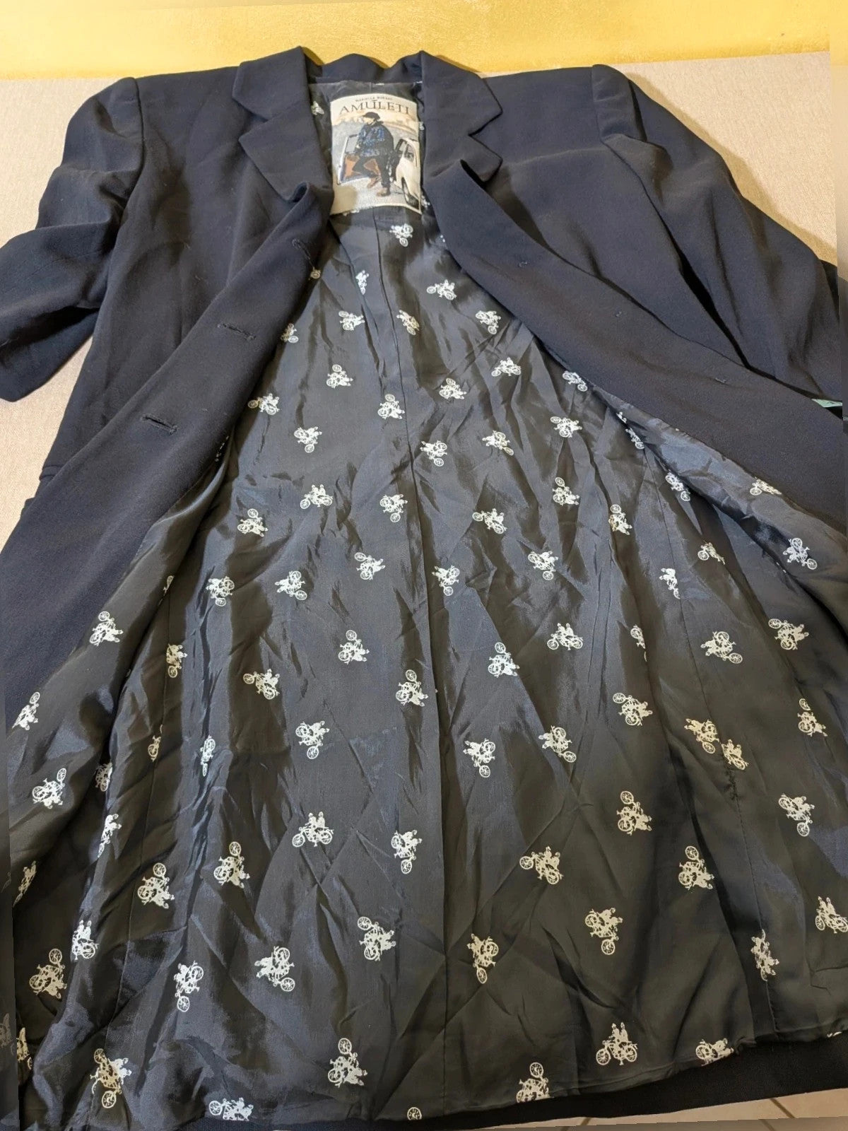 Mariella Burani navy skirt suit with elegant blazer and vintage bicycle print lining.