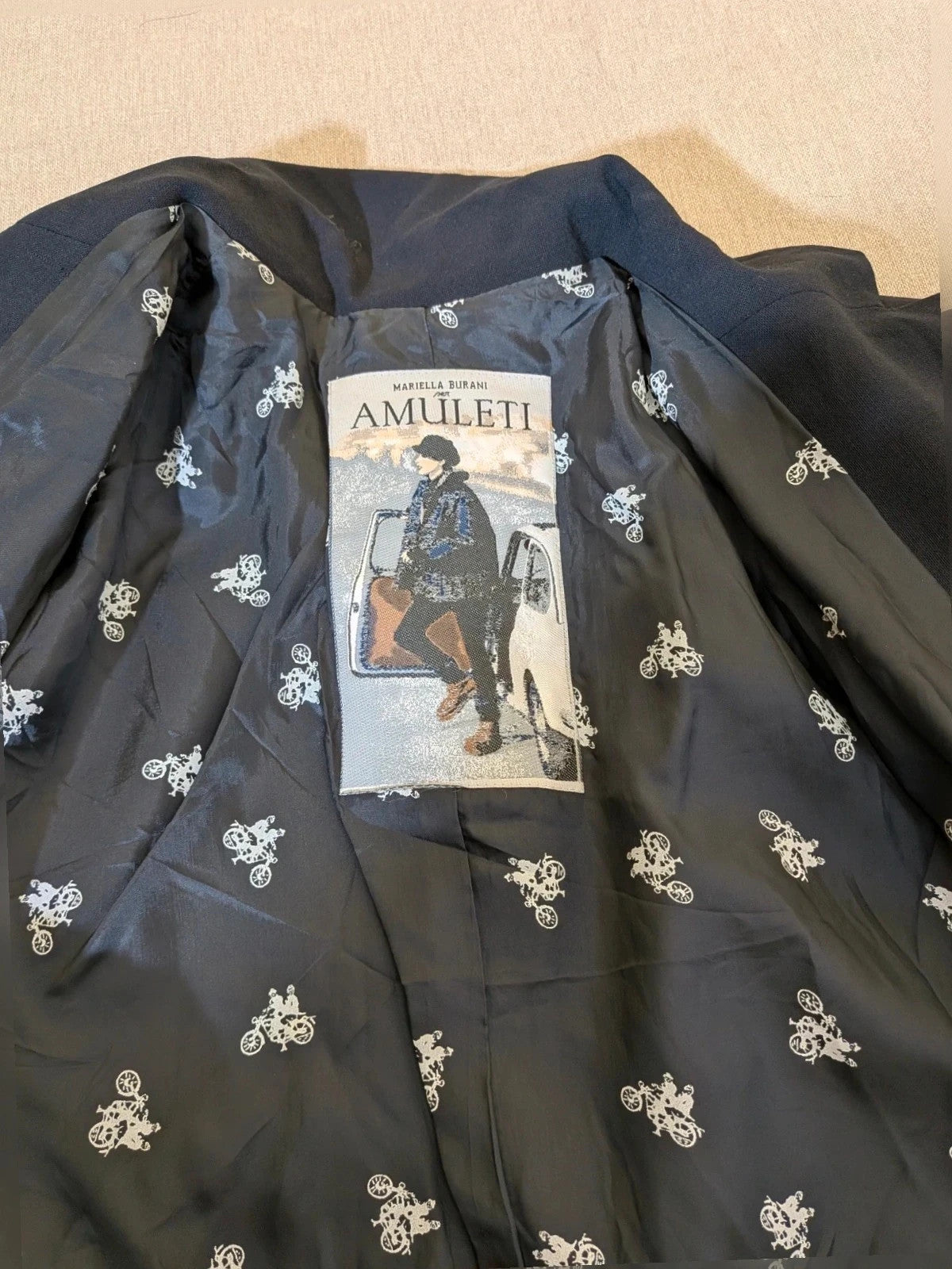 Mariella Burani navy skirt suit with elegant blazer and vintage bicycle print lining.