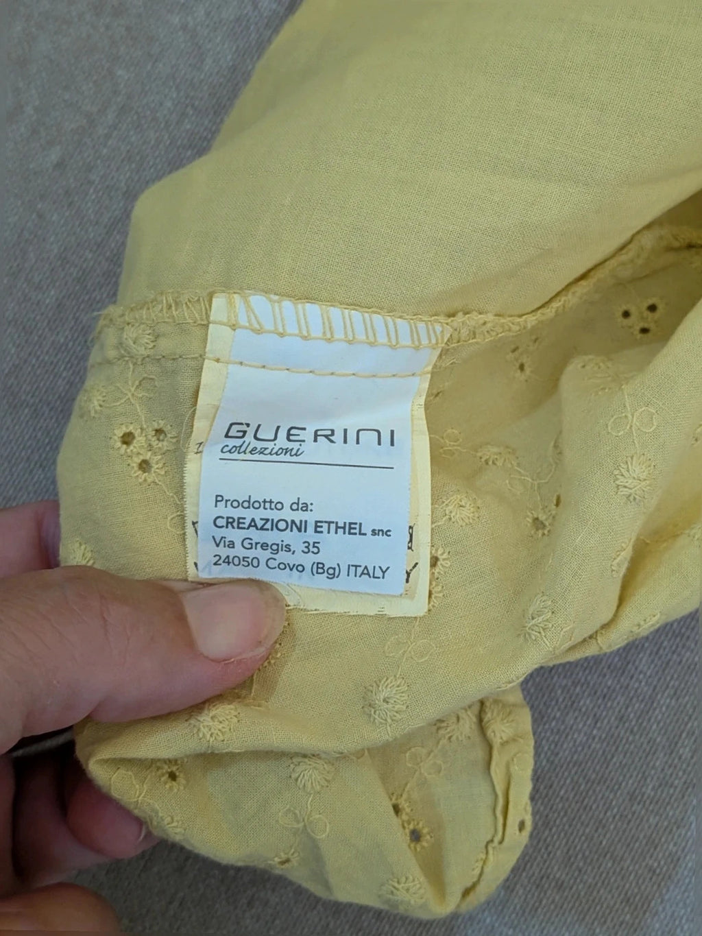 Guerini yellow short-sleeve top with lace Sangallo pattern and front button closure.