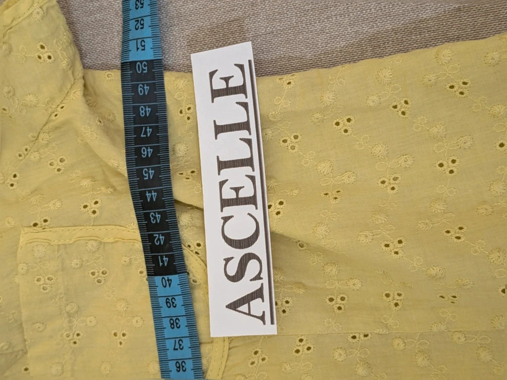 Guerini yellow short-sleeve top with lace Sangallo pattern and front button closure.