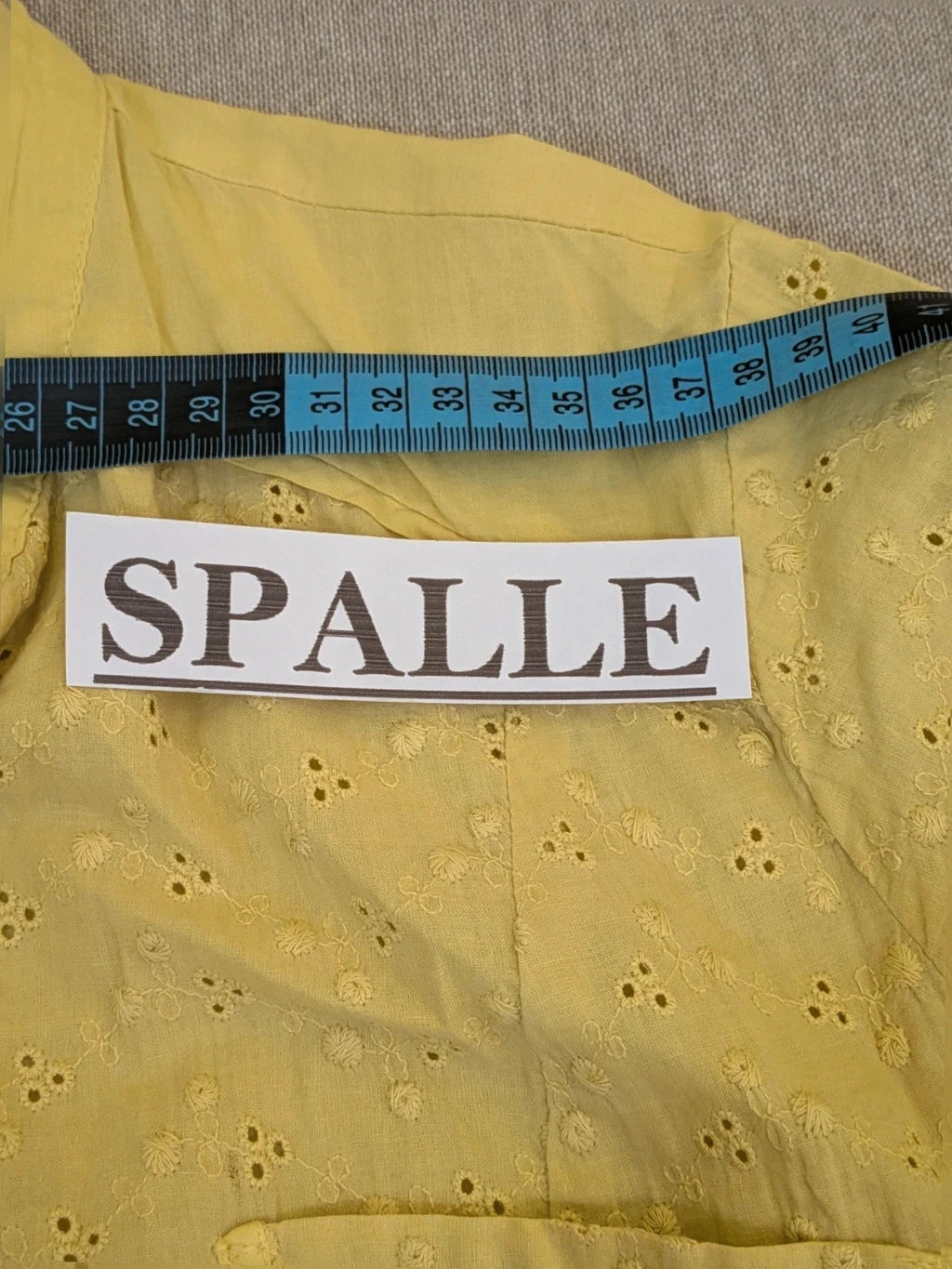 Guerini yellow short-sleeve top with lace Sangallo pattern and front button closure.