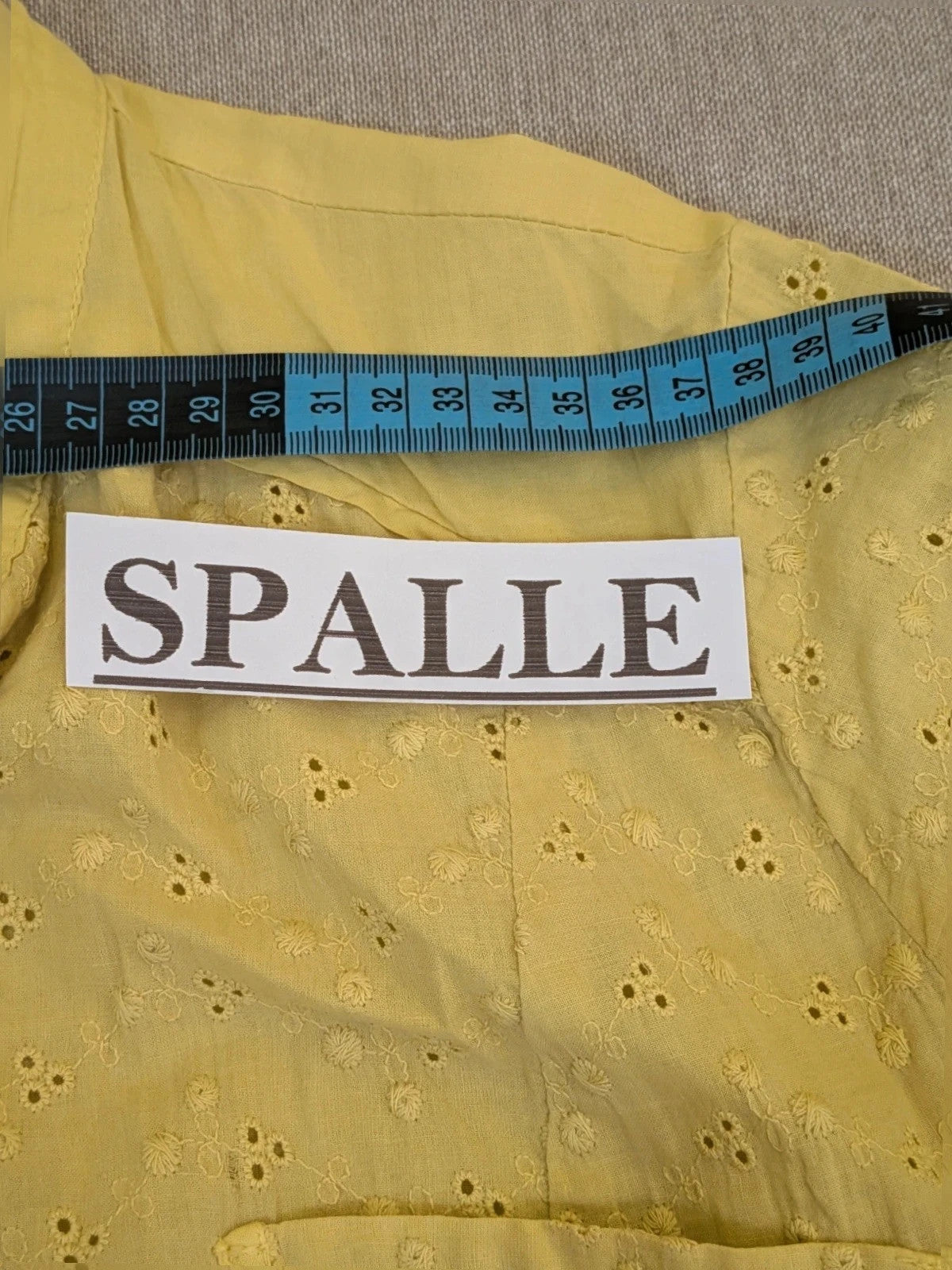 Guerini yellow short-sleeve top with lace Sangallo pattern and front button closure.