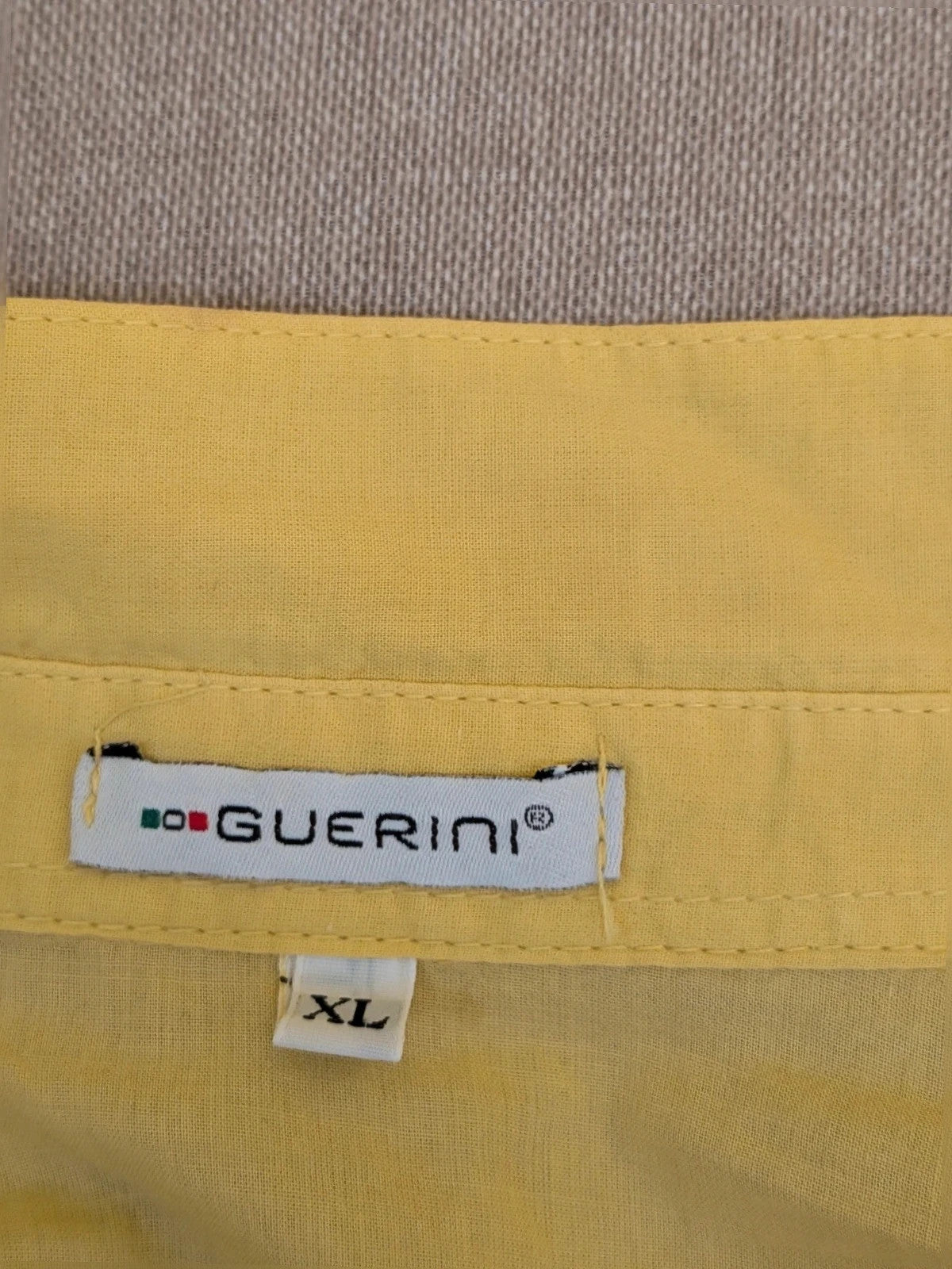Guerini yellow short-sleeve top with lace Sangallo pattern and front button closure.