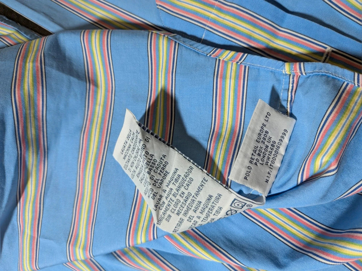 Polo Ralph Lauren multicolor striped shirt with pink pony logo on sky blue background.