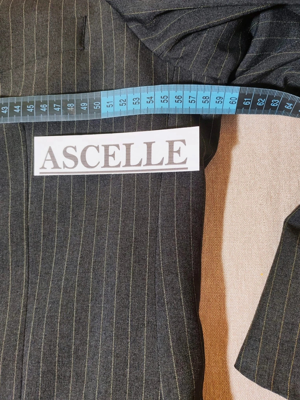 Per Una grey suit jacket and trousers, pinstripe pattern, three-button closure, excellent condition.