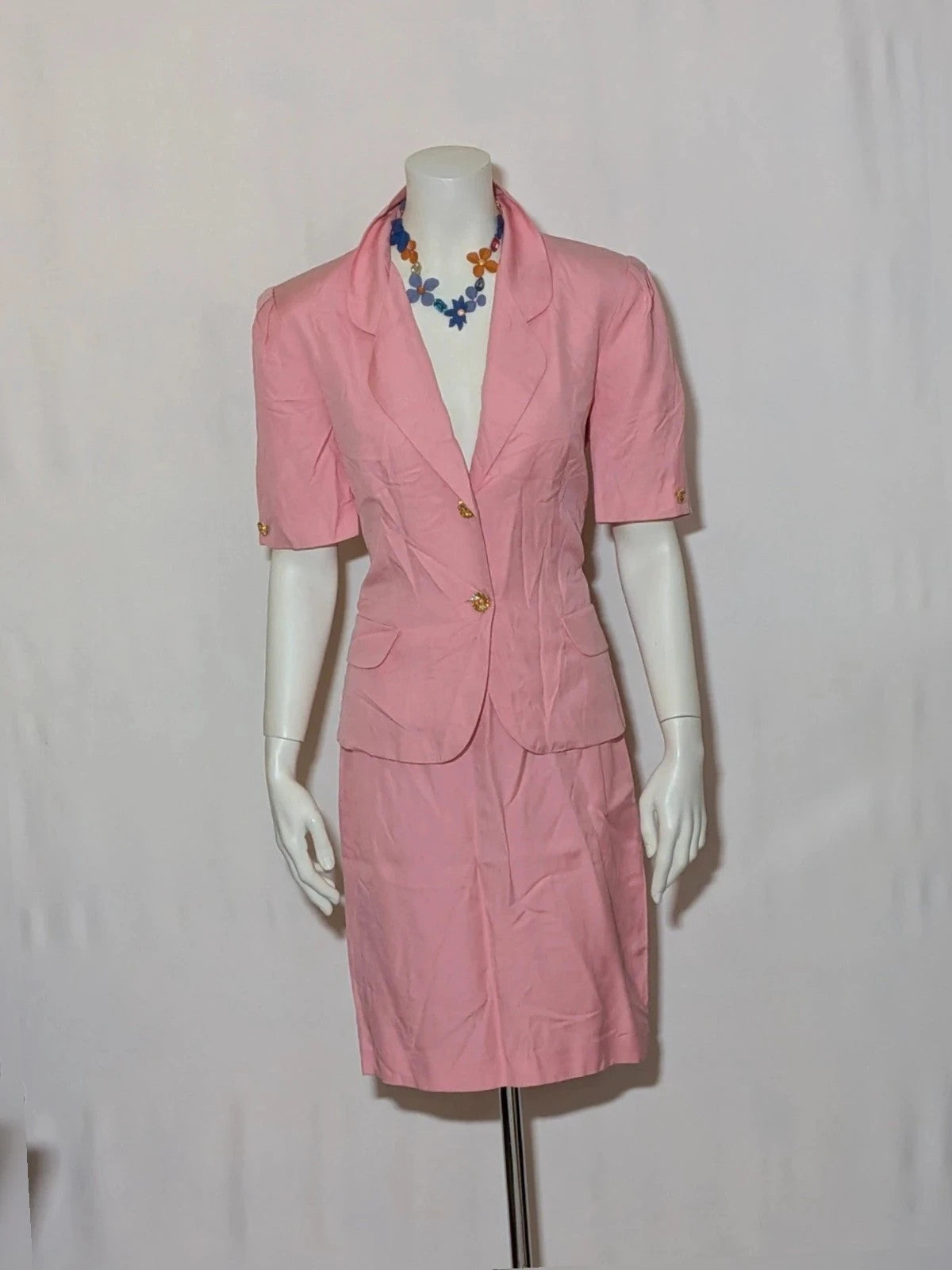 Anna Gasparri pink skirt suit with structured fabric and gold buttons, vintage 80s/90s style.