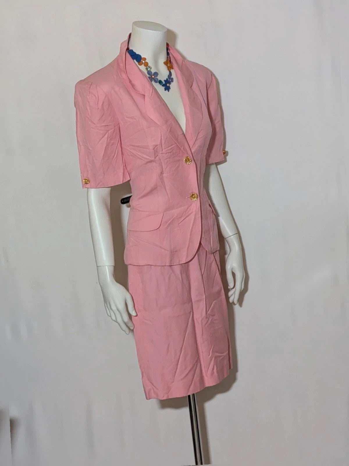 Anna Gasparri pink skirt suit with structured fabric and gold buttons, vintage 80s/90s style.