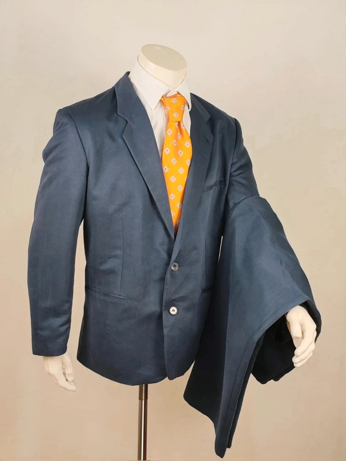 Vintage navy jacket and trousers set, luxurious silk-wool blend, elegant formal style.
