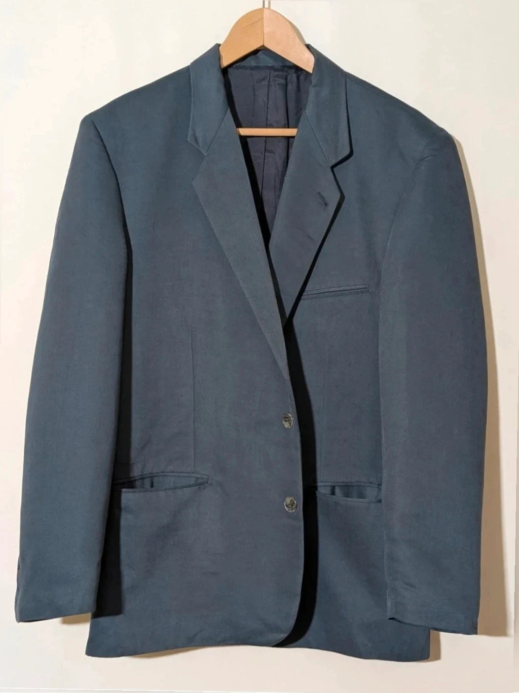 Vintage navy jacket and trousers set, luxurious silk-wool blend, elegant formal style.