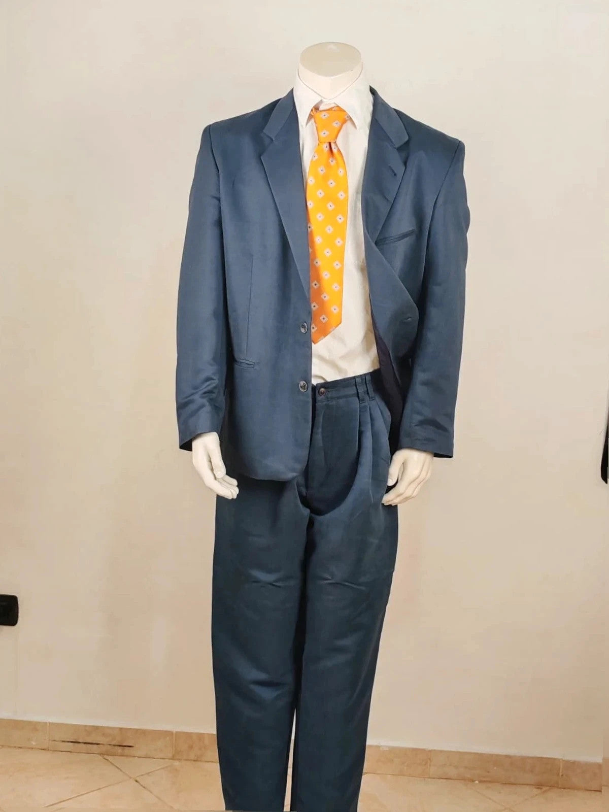 Vintage navy jacket and trousers set, luxurious silk-wool blend, elegant formal style.