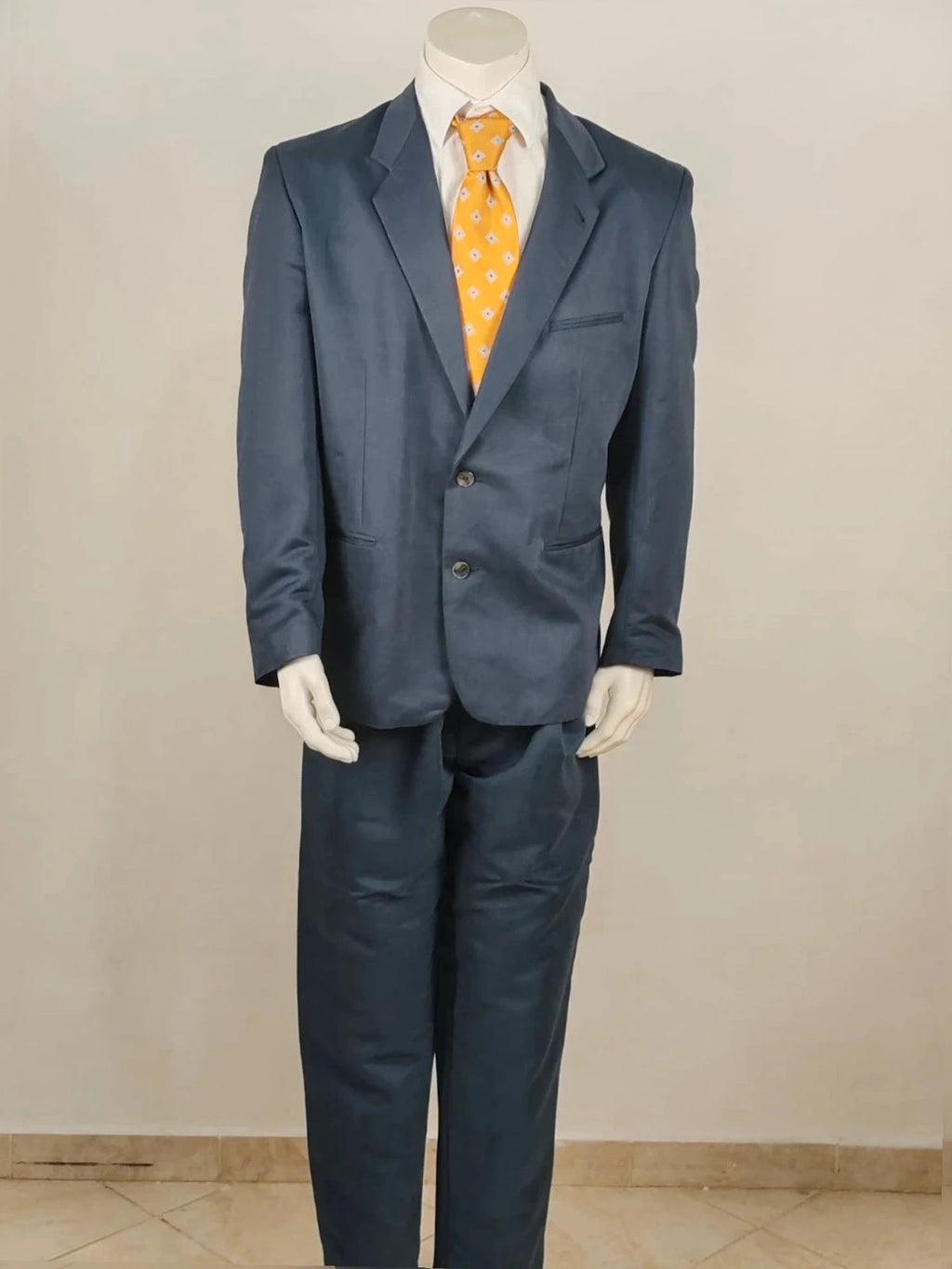 Vintage navy jacket and trousers set, luxurious silk-wool blend, elegant formal style.