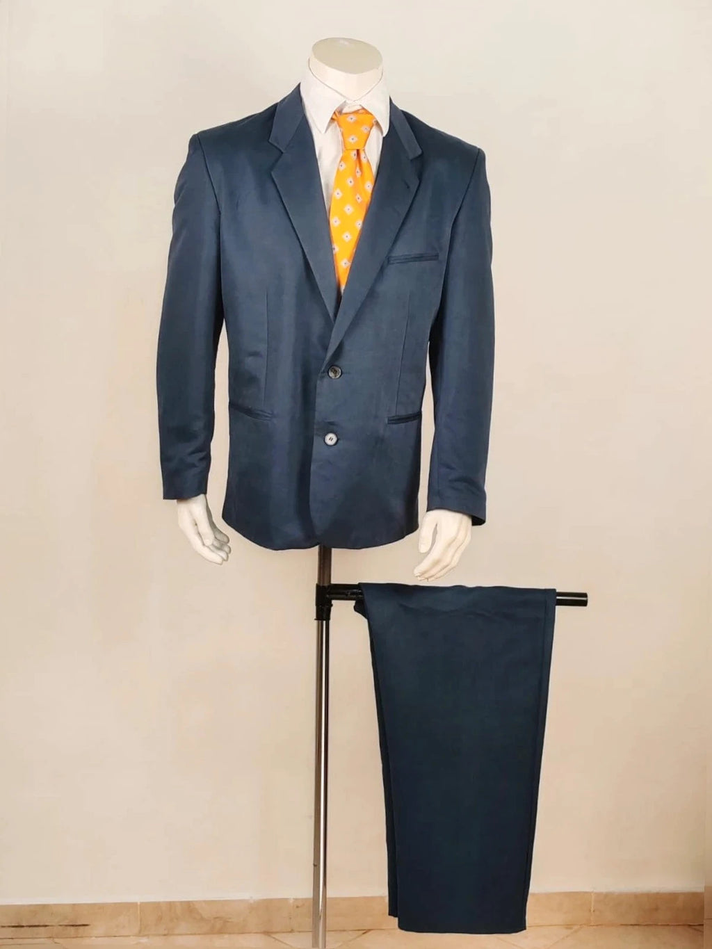 Vintage navy jacket and trousers set, luxurious silk-wool blend, elegant formal style.