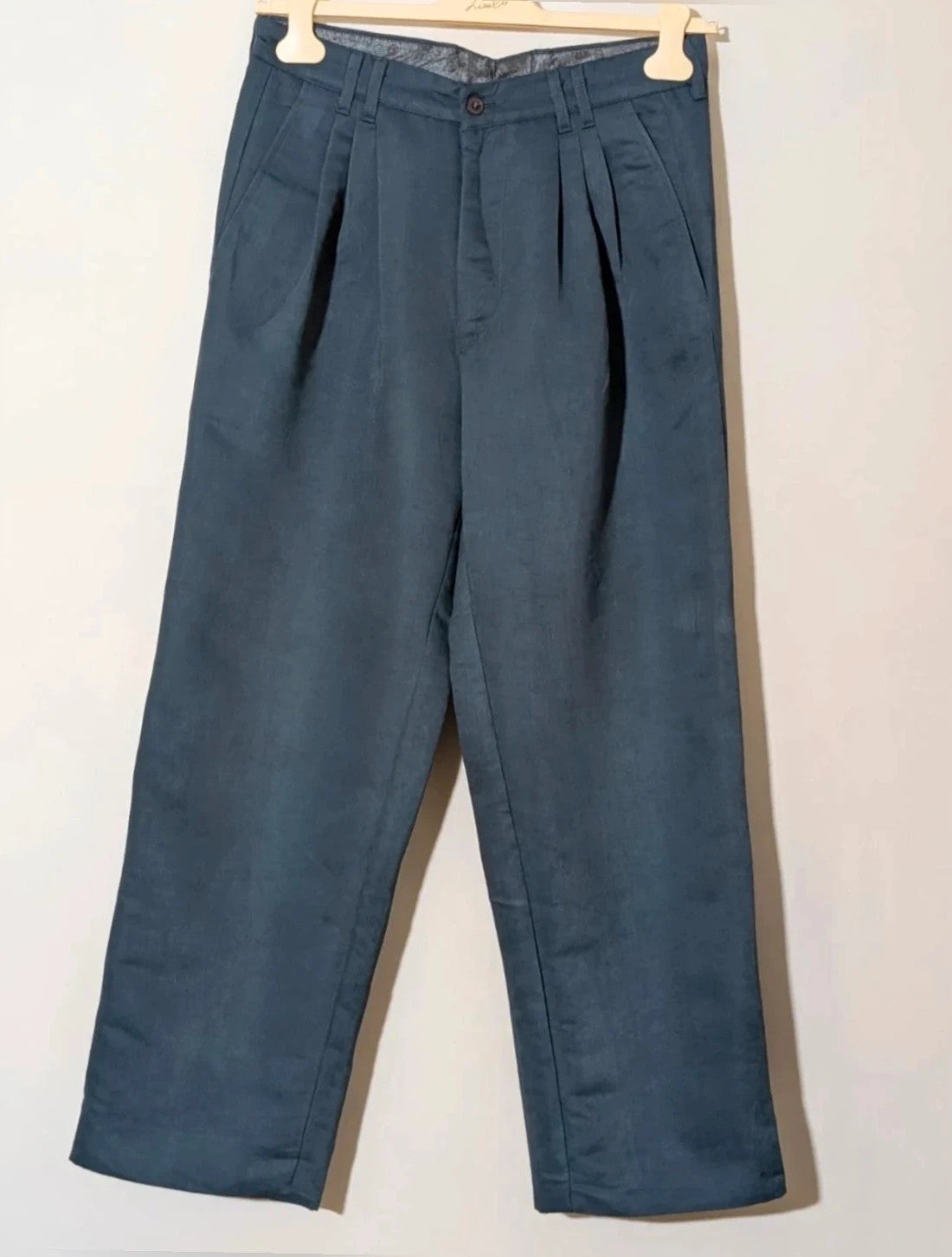 Vintage navy jacket and trousers set, luxurious silk-wool blend, elegant formal style.