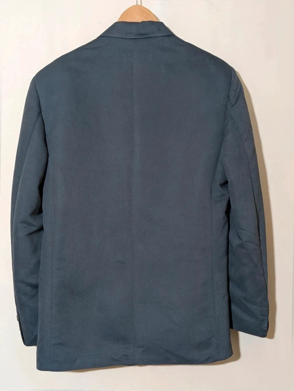 Vintage navy jacket and trousers set, luxurious silk-wool blend, elegant formal style.