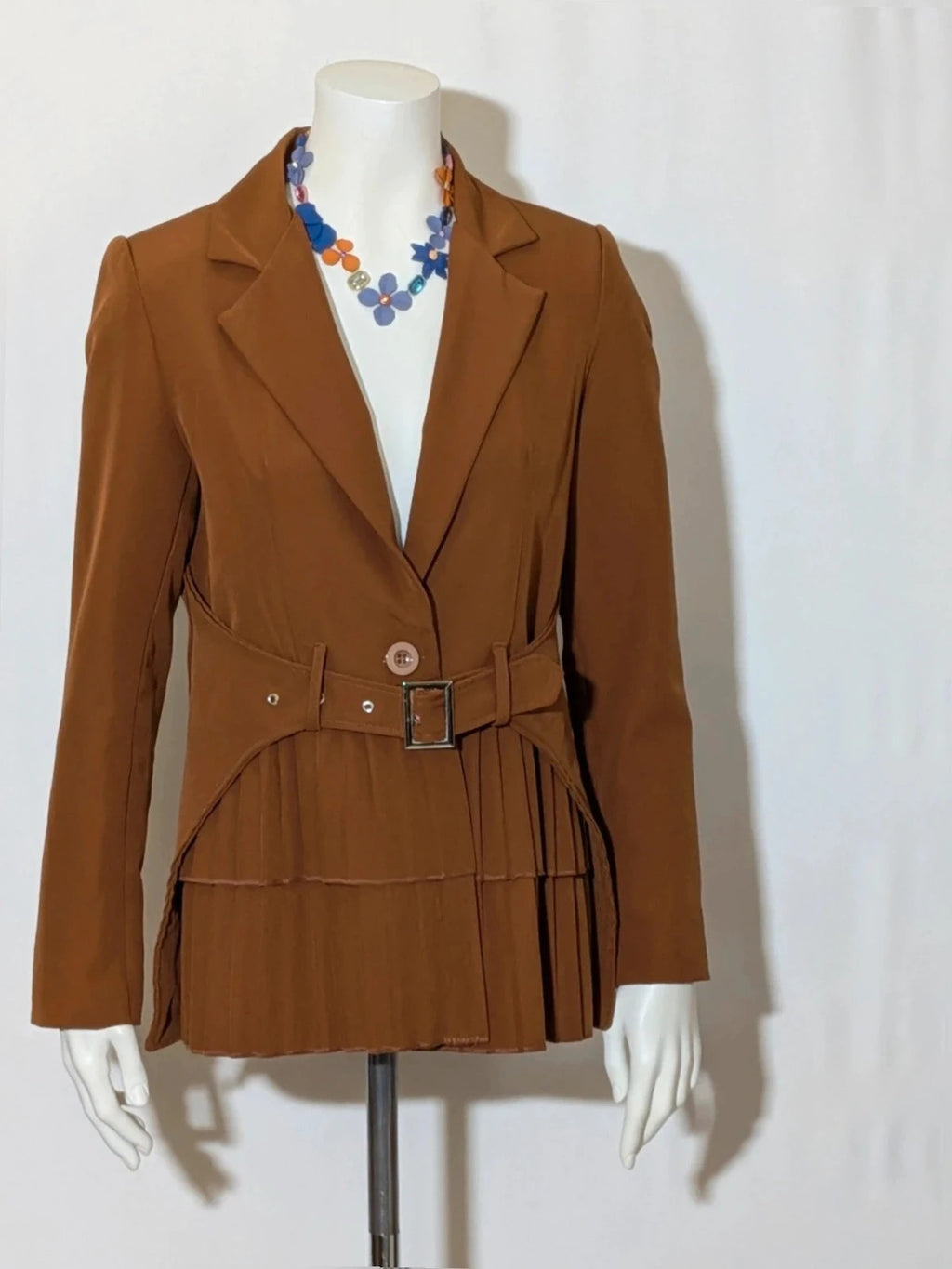 New Collection brown blazer with unique design and feminine belt detail.