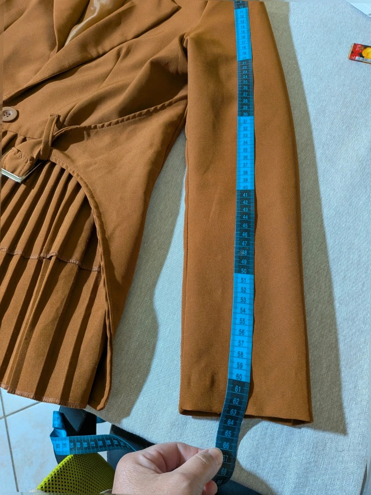 New Collection brown blazer with unique design and feminine belt detail.
