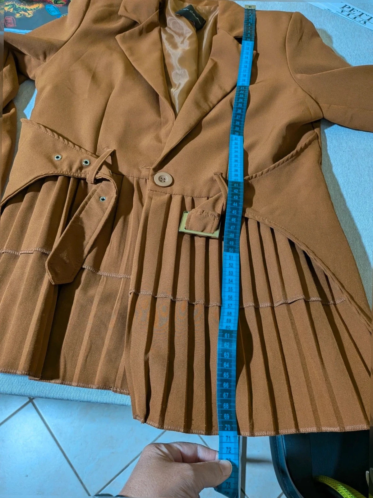 New Collection brown blazer with unique design and feminine belt detail.