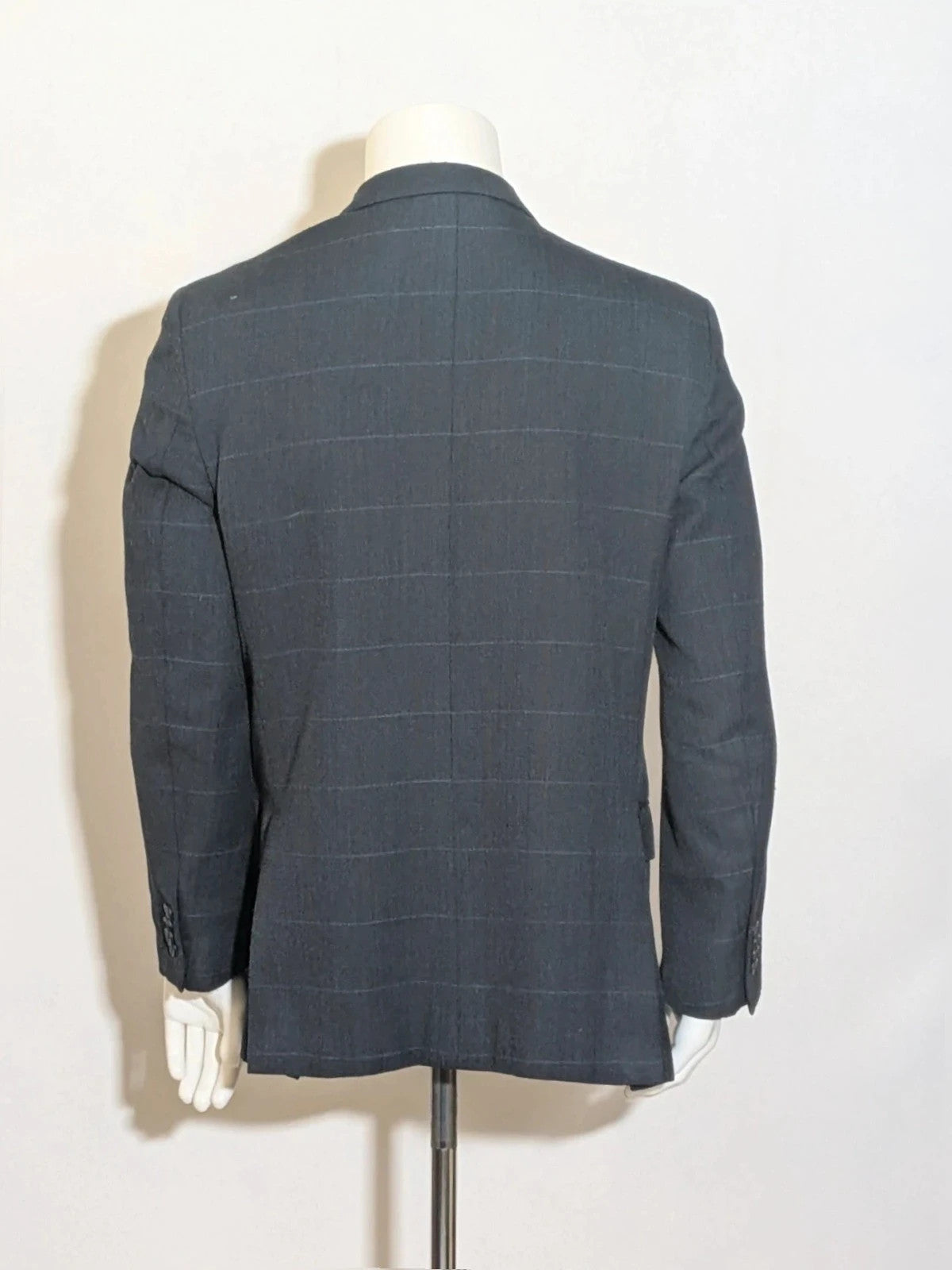 Up Grade Classico grey jacket herringbone pattern three-button front with pocket flaps.
