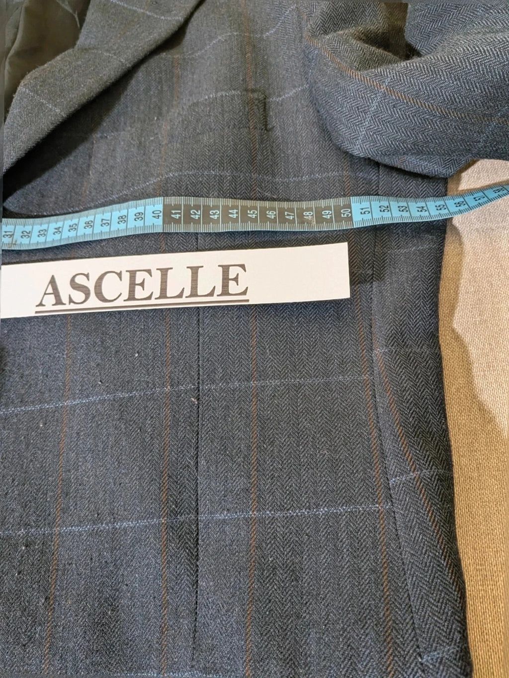 Up Grade Classico grey jacket herringbone pattern three-button front with pocket flaps.