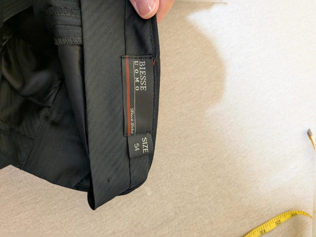 Biesse black jacket with subtle pinstripe pattern and Black Label logo.