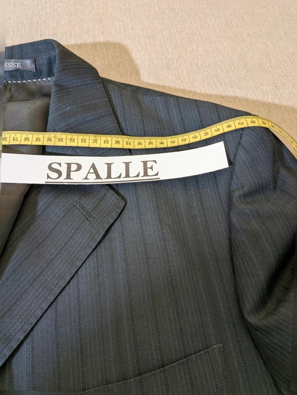 Biesse black jacket with subtle pinstripe pattern and Black Label logo.