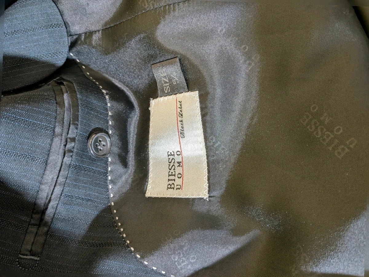 Biesse black jacket with subtle pinstripe pattern and Black Label logo.