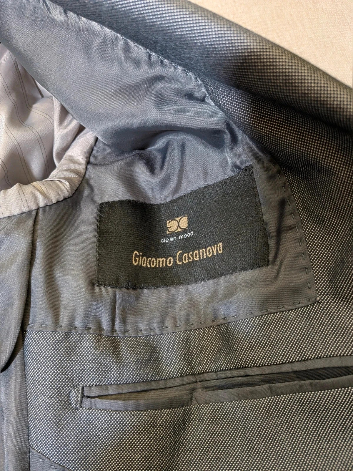 Giacomo Casanova grey jacket micro-flame pattern elegant formal wear.