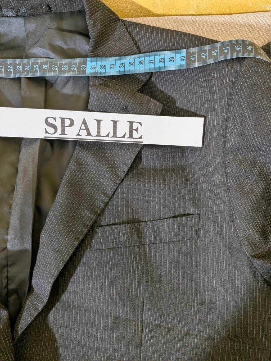 Radaus black suit with modern cut, purple contrast lining, soft viscose blend.