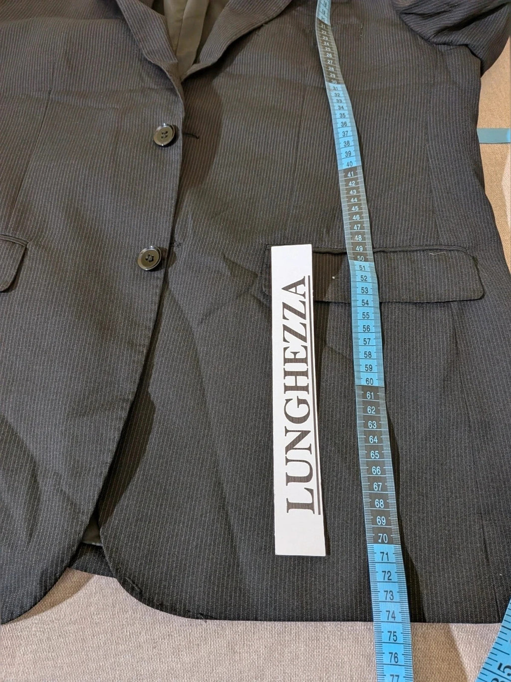 Radaus black suit with modern cut, purple contrast lining, soft viscose blend.
